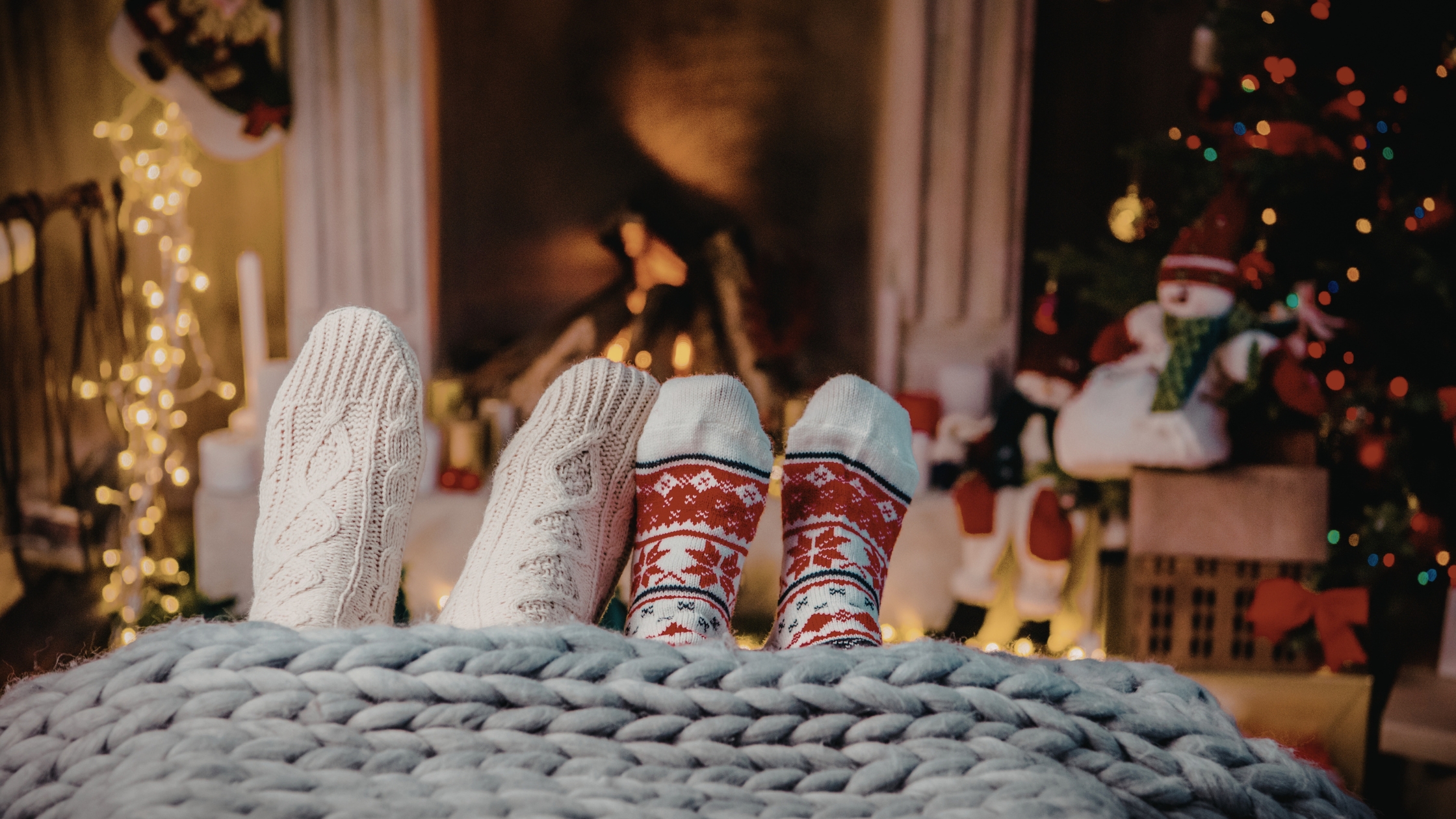Co-parenting during the holidays guide with warm winter decor symbolizing peace and connection between two homes